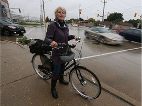 Windsor cyclist Jennifer Escott is photographed at Walker Road and Ypres Avenue in Oct. 20, 2016.