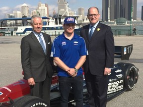 Chevrolet Detroit Grand Prix chairman Bud Denker, left, Verizon IndyCar driver Conor Daly and Windsor Mayor Drew Dilkens pose at the Riverfront Festival Plaza in Windsor on April 11, 2017.