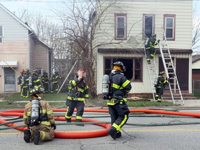 Windsor firefighters work at the seen of a fire at 3418 Sandwich Street in Windsor on Tuesday April 11, 2017.