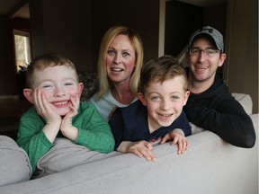 Luke Gerard, 4, left, with his mother Lindsay, brother Joshua and father Mark at their Tecumseh, Ont., home on April 12, 2017.