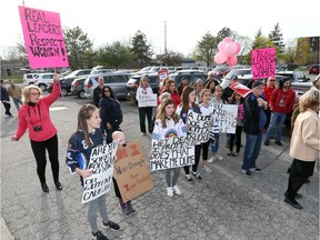 Protesters rally outside the Windsor Minor Hockey Association annual general meeting held at Average Joes Sports Bar in Windsor, Ont., on April 18, 2017.