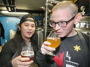 Walkerville Brewery's Jeffrey Craig, right, has collaborated with Craft Heads Brewing Company co-owner Bryan Datoc, left, to create a dandelion beer called Fine N' Dandy. The two are shown testing out the beer on April 21, 2017.