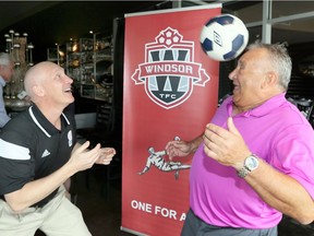 Showing he can still play, Hall of Fame inductee Tony Tiselj, right, has some fun with Bill Harding, Toronto FC president, during a news conference held at Mezzo Restaurante on April 27, 2017.