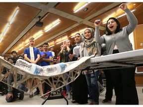 Vincent Massey Secondary School students cheer as a bridge, constructed from popsicle sticks, is tested during Massey Day at the University of Windsor engineering school on April 27, 2017.