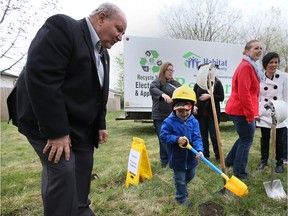 Riley Kutyma, 3, and his mother Lyndsay Kutyma, behind, happily participate in a groundbreaking ceremony on April 29, 2017 for their new home, being built by Habitat for Humanity Windsor-Essex. City of Windsor councillor Ed Sleiman, left, and about a dozen other civic and provincial officials attended the event.
