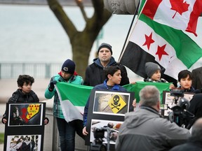 A group of about 50 local residents of Syrian descent, including Nazir Khlif, centre, gathered at Piazza Udine on the Windsor riverfront to bring awareness to reports of gas being used in Syria April 4, 2017.