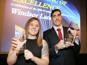 Krystin Lawrence, left, holds the Banner Shield Award and Corey Bellemore holds the Olympic Shield Award during the University of Windsor Lancers Evening of Excellence Awards Banquet at St. Clair College Centre for the Performing Arts April 5, 2017.