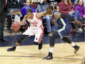Darren Duncan of the Windsor Express drives past Kirk Williams Jr. of the Niagara River Lions in NBL Canada action from the WFCU Centre on April 5, 2017.