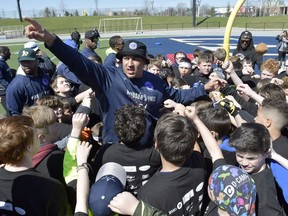 Tyrone Crawford, a professional football player with the NFL's Dallas Cowboys, coaches area players during Windsor's Finest Football Academy on April 8, 2017 at University of Windsor's Alumni Field.