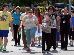 A group of women take part in Walking Wednesdays at Charles Clark Square on Aug. 3, 2016.