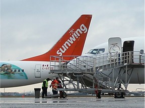 A Sunwing passenger jets is seen at Windsor Airport on Dec. 21, 2015 in Windsor, Ont.