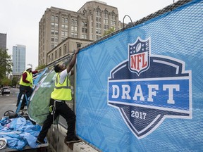 Workers make preparations ahead of the 2017 NFL football draft in Philadelphia on April 26, 2017.