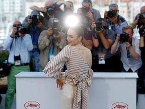 Actress Lily Collins poses for photographers during the photo call for the film Okja at the 70th international film festival, Cannes, southern France, Friday, May 19, 2017. (AP Photo/Alastair Grant)