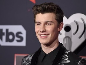 FILE - In this March 5, 2017, file photo, Shawn Mendes arrives at the iHeartRadio Music Awards at the Forum in Inglewood, Calif. Mendes told a crowd in Paris on May 24, 2017, that they should ‚Äúnever be afraid to enjoy music‚Äù days after the deadly bombing of an Ariana Grande concert in England. (Photo by Jordan Strauss/Invision/AP, File)