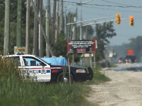 An Amherstburg police cruiser uses a speed gun to target speeding vehicles on Howard Avenue on Aug. 29, 2012.