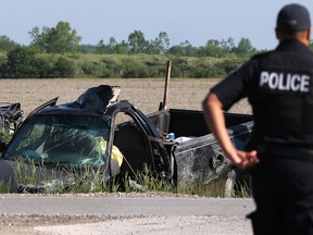 An Amherstburg police officer is shown at the on scene of a serious collision at County Road 10 and Concession 8 on May 27, 2017.