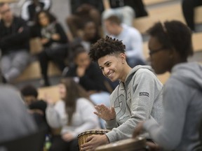 Marquise Lara-Caston, a Grade 12 student at Kennedy Collegiate, plays during a drum session led by TeaJai Travis at the Blackness and Canadian Identity Conference for local high school students at St. Clair College on May 2, 2017.