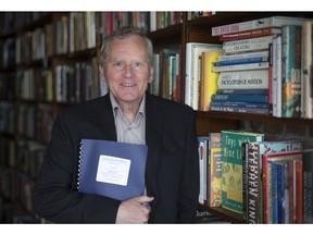 Author Pat Brode is pictured May 25, 2017, at Biblioasis with the manuscript to his upcoming book, Border Cities Powerhouse: The Rise of Windsor 1901-1945.