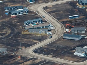 This aerial view on April 19, 2017, shows a residential neighbourhood in Fort McMurray, Alta., where some homes have been rebuilt but many have not, one year after the Fort McMurray fire.