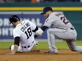 Detroit Tigers' Tyler Collins beats the tag of Cleveland Indians second baseman Jason Kipnis at second base, advancing on fly out by Michael Brantley during the fifth inning of a baseball game in Detroit, May 3, 2017.