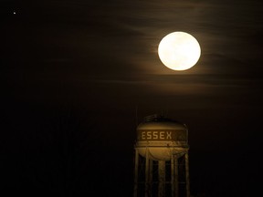 A full moon over the Town of Essex water tower, February 23, 2016.
