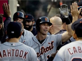 Detroit Tigers' Andrew Romine celebrates in the dugout after his two-run home run during the second inning of a baseball game against the Los Angeles Angels in Anaheim on May 11, 2017.