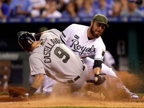 Nicholas Castellanos of the Detroit Tigers slides safely into home to score on a wild pitch as pitcher Joakim Soria of the Kansas City Royals covers the plate during the 8th inning of the game at Kauffman Stadium on May 29, 2017 in Kansas City, Missouri.