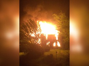 A view of the flames that engulfed an abandoned farmhouse in the 2100 block of Myers Road in Lakeshore on May 22, 2017.