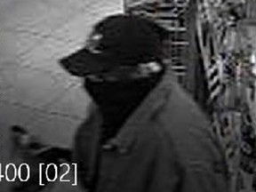 This surveillance photo provided by the OPP shows a robbery suspect at the I.D.A. pharmacy in the 11000 block of Tecumseh Road in Tecumseh on May 4, 2017.