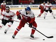 Czech Republic's Libor Sulak (8) keeps the puck away from Switzerland's Vincent Praplan during the IIHF men's world hockey championship Group B match on May 16, 2017 in Paris.