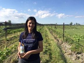 Melissa Muscedere, an operator at Muscedere Vineyards, is shown with a bottle of the EPIC 1867 Limited Wine Series on May 27, 2017.