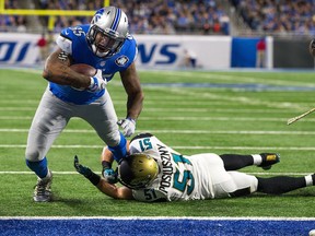 Tight end Eric Ebron of the Detroit Lions breaks the tackle of Paul Posluszny of the Jacksonville Jaguars to score a touchdown during the second half of an NFL game at Ford Field on Nov. 20, 2016 in Detroit.