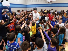 National Football League player Luke Willson paid a visit to Holy Cross Catholic Elementary School May 26, 2017 to speak with students and staff.