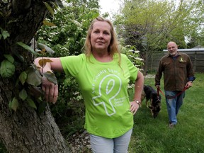 Cheryl Abbate, spokeswoman with Sun Parlour Lyme Awareness Support Group is shown with her husband Nate Abbate and their dog Summer. Cheryl was diagnosed with Lyme disease in 2007.