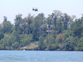 An Ontario Provincial Police helicopter is flown over Lake Erie in Kingsville, Ont., as the search continues on May 29, 2017 for a 25-year-old male involved in a canoe mishap.