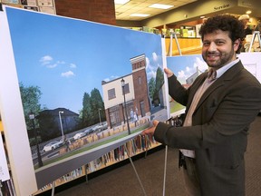 The Windsor Public Library hosted an open house on May 10, 2017, for its new branch at the former Sandwich Fire Hall. The event was held at the current Sandwich branch. Architect Jason Grossi, who designed the renovations, poses with a rendering of the new branch.