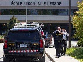 Essex County OPP officers at the scene of the lockdown at L'Essor high school on May 9, 2017.
