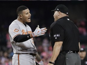 Baltimore Orioles' Manny Machado argues a strike call with home plate umpire Mark Carlson that ended the team's baseball game against the Detroit Tigers on May 17, 2017, in Detroit. Detroit won 5-4.