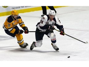 Sean Day, seen in action at right against the Erie Otters, was returned to the Windsor Spitfires on Sunday by the NHL's New York Rangers.  (DAN JANISSE/The Windsor Star)