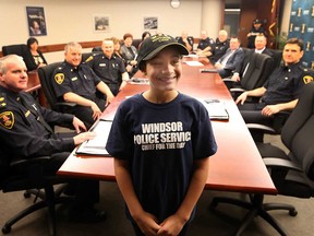 Nia Robert of Dougall Public School stands before senior Windsor police officers as their Chief for a Day on May 11, 2017.
