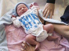 Newborn Gabriel Zagar sports a WIN CITY onesie at Windsor Regional Hospital's Met campus on May 18, 2017. BB Branded is giving out WIN CITY onesies to newborns on May 19 as part of the city's 125th birthday celebrations.