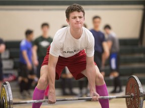 Josh Kader, from Belle River Distict High School, competes in the dead-lift portion of the annual High School Powerlifting Meet at Belle River high school on May 12, 2017.