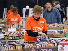 Last year's Windsor Star Raise-A-Reader book sale on April 16, 2016, was a bargain bonanza for those who love to read. Here, volunteer Denise Brown helps arrange some of the offerings.