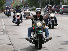 Bikers cruise down Riverside Drive during the Telus Motorcycle Ride for Dad on Sunday, May 28, 2017. The event kicked off at the Festival plaza downtown and winding through parts of the county.