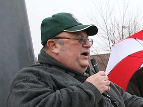 Rolly Marentette, chair of the Injured Workers Coalition, speaks at an outdoor rally in December 2007.