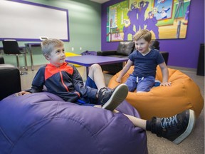 Lucas Crawford, 7, and Hudson Rudak, 4, enjoy the bean bag chairs May 15 in the Youth Advisory Committee Lounge, part of the Smile Zones at the Windsor-Essex Children's Aid Society.