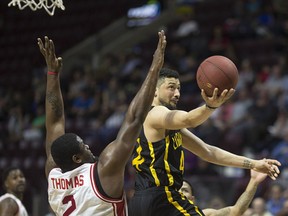 London's Ryan Anderson drives past Windsor's DeAndre Thomas during NBL of Canada action between the London Lightning and the Windsor Express at WFCU Centre on April 23, 2017.