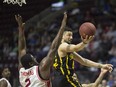 London's Ryan Anderson drives past Windsor's DeAndre Thomas during NBL of Canada action between the London Lightning and the Windsor Express at WFCU Centre on April 23, 2017.