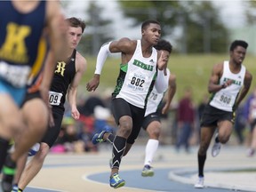 Herman's Patrick Quinland, centre, helped the Green Griffins to a silver medal in the open boys' 4x400-metre relay at the OFSAA track and field championships in Belleville on June 3. Quinland is shown above running in the senior boys' 200m final at the WECSSAA track and field championships at the University of Windsor's Alumni Field on May 11, 2017.