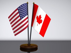 U.S. flag and Canadian desk flags 3D illustration by Getty Images.
